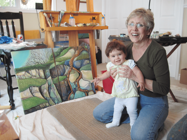 Lynn in her Corbeil, Ontario painting studio with granddaughter Laura, 2012.