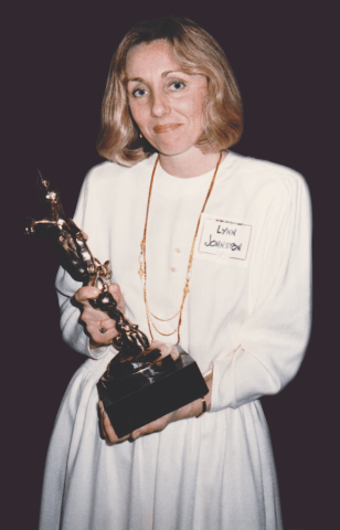 A stunned-looking Lynn with her Reuben Award, 1986. She was the first female and the first Canadian to win the award.